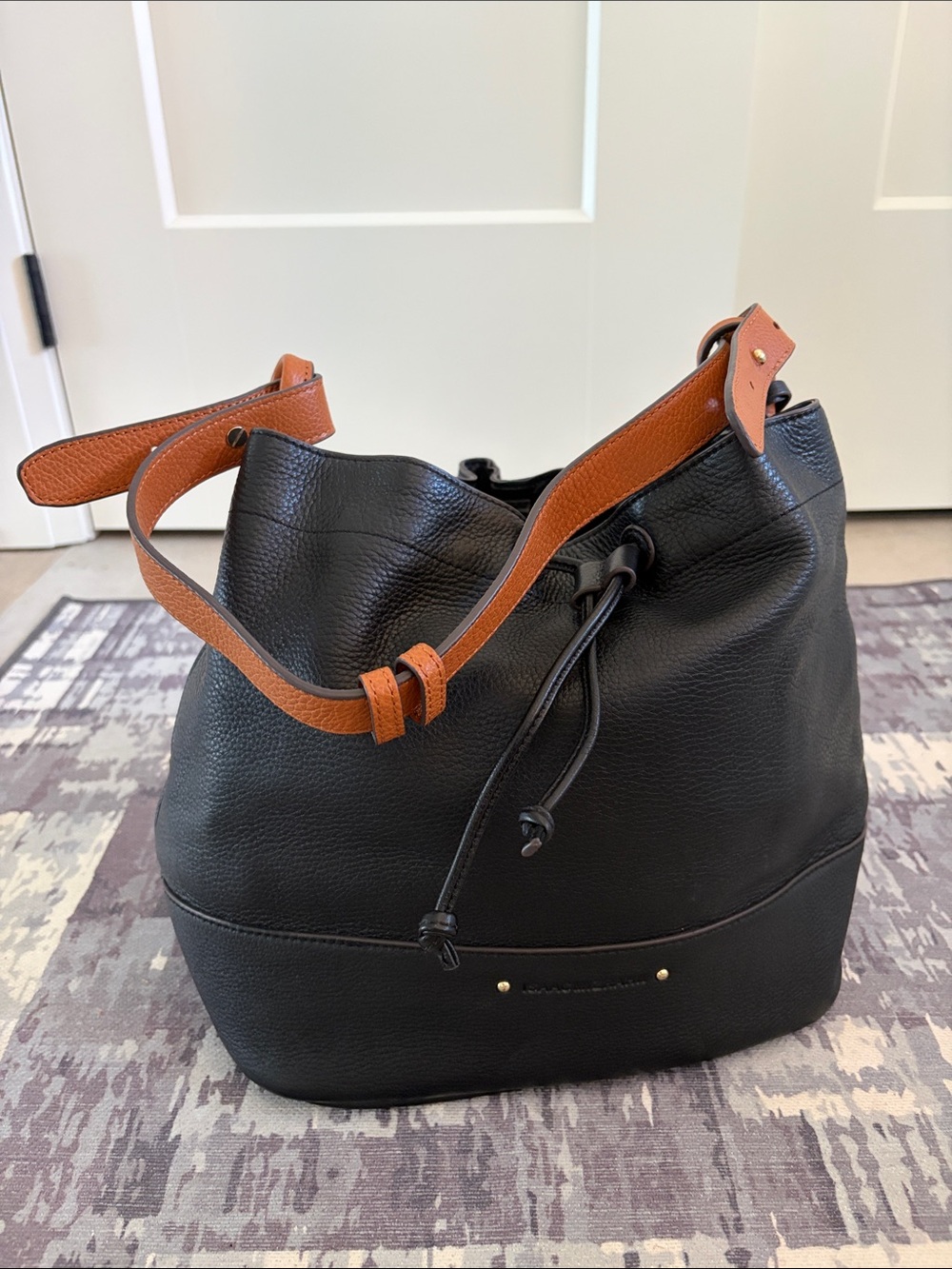 Isaac Mizrahi Black Leather Bucket Bag with Tan Strap